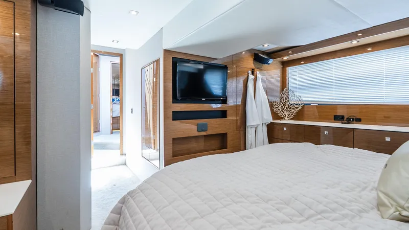 Belle Yacht Photos Pics Luxurious bedroom interior of 2018 Cruisers Yachts 50 Cantius with modern amenities.