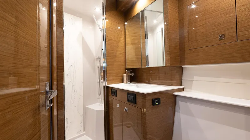 Belle Yacht Photos Pics Luxurious bathroom interior of 2018 Cruisers Yachts 50 Cantius with modern fixtures.