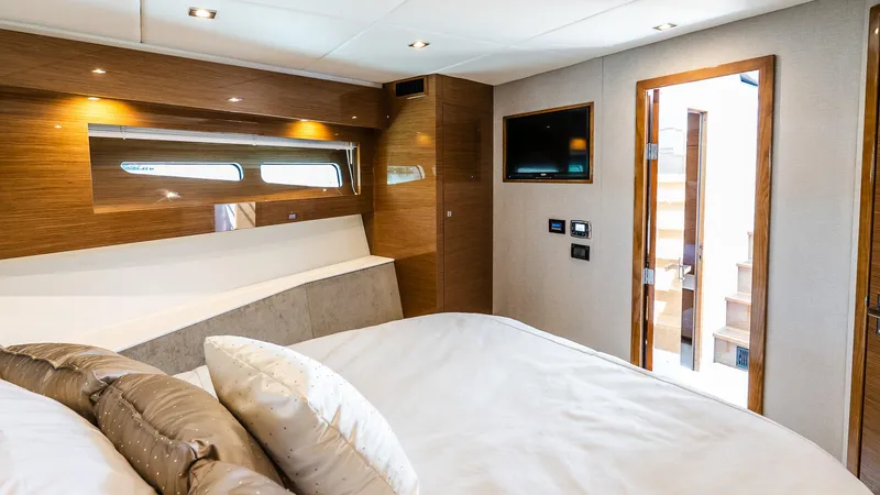 Belle Yacht Photos Pics Luxurious bedroom interior of 2018 Cruisers Yachts 50 Cantius with modern amenities.