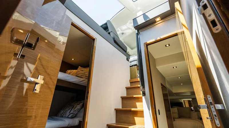 Belle Yacht Photos Pics Interior view of 2018 Cruisers Yachts 50 Cantius, featuring stairs and cabin doors.