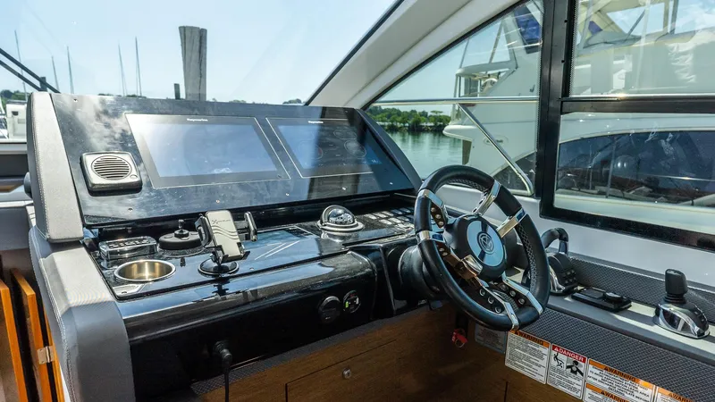 Belle Yacht Photos Pics Helm of 2018 Cruisers Yachts 50 Cantius with modern controls and steering wheel.