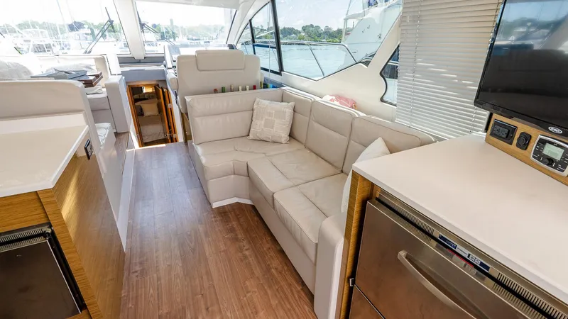 Belle Yacht Photos Pics Luxurious interior of 2018 Cruisers Yachts 50 Cantius with modern seating and appliances.