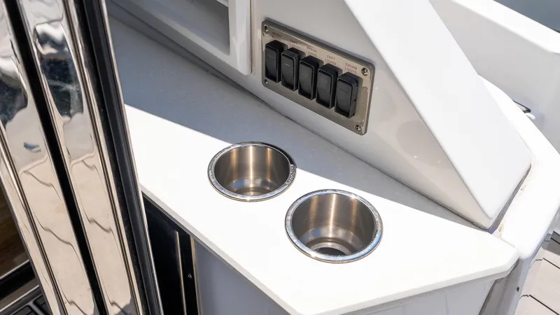 Belle Yacht Photos Pics Control panel and cup holders on 2018 Cruisers Yachts 50 Cantius.