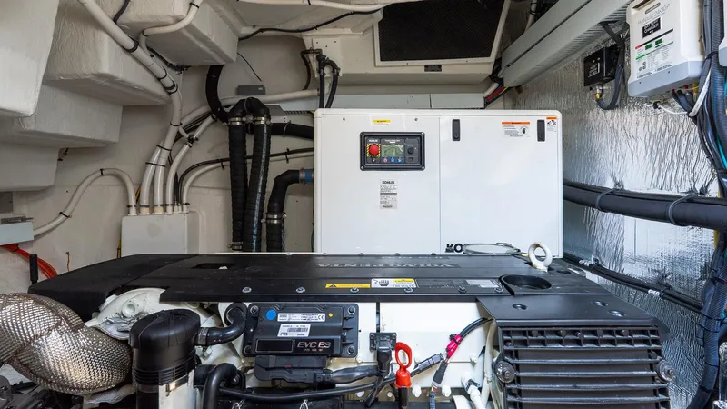 Belle Yacht Photos Pics Engine room of 2018 Cruisers Yachts 50 Cantius with generator and wiring.