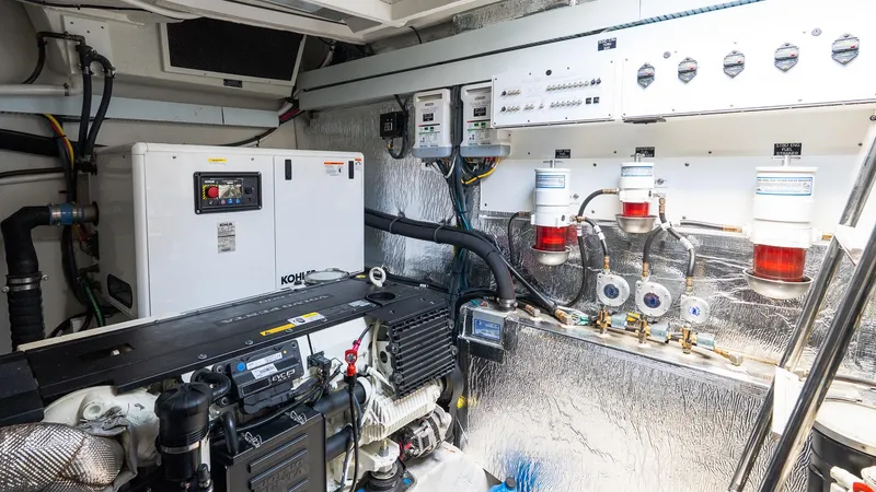 Belle Yacht Photos Pics Engine room of 2018 Cruisers Yachts 50 Cantius with generator and control panels.