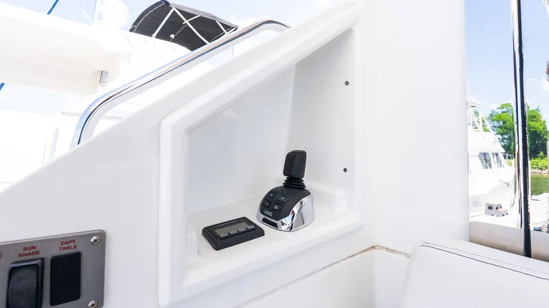 Belle Yacht Photos Pics Control panel on 2018 Cruisers Yachts 50 Cantius, featuring joystick and buttons.