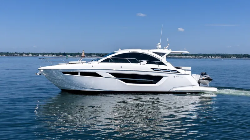 Belle Yacht Photos Pics 2018 Cruisers Yachts 50 Cantius on calm water, showcasing sleek design and luxury features.