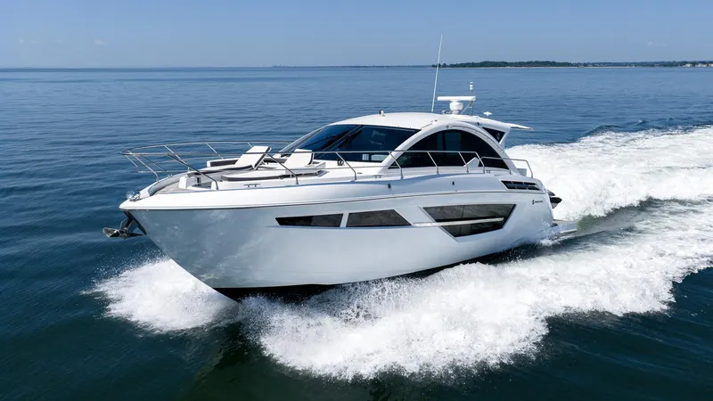 Belle Yacht Photos Pics 2018 Cruisers Yachts 50 Cantius cruising on open water, showcasing sleek design and luxury.