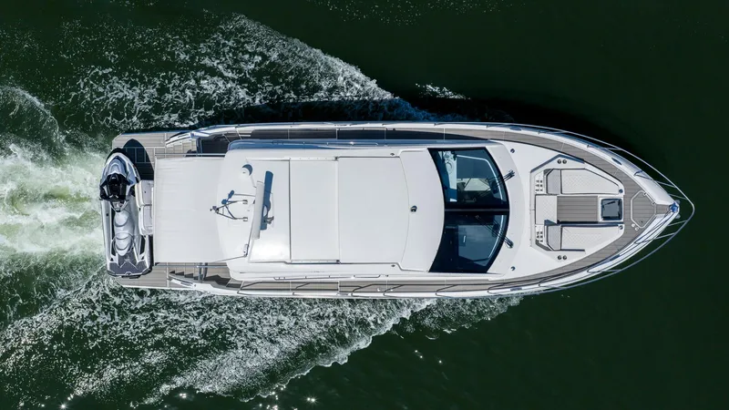 Belle Yacht Photos Pics Overhead view of 2018 Cruisers Yachts 50 Cantius cruising on water.
