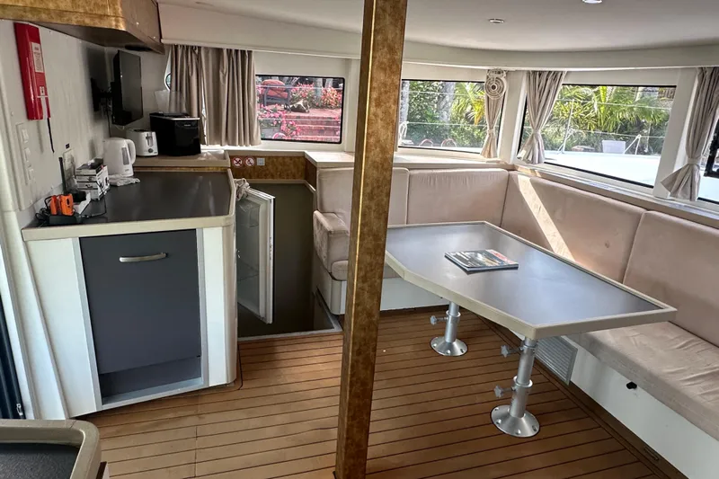 Bolubo Yacht Photos Pics Interior of 2019 Lagoon 42 catamaran with kitchen and dining area.