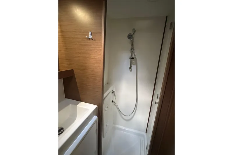 Bolubo Yacht Photos Pics Bathroom interior of 2019 Lagoon 42 yacht with shower and sink.