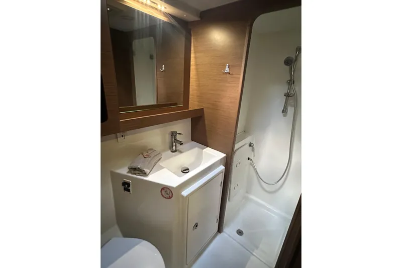 Bolubo Yacht Photos Pics Bathroom interior of 2019 Lagoon 42 yacht with shower and sink.