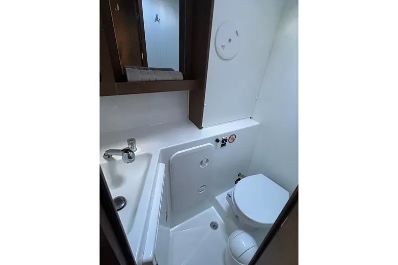 Bolubo Yacht Photos Pics Compact bathroom in a 2019 Lagoon 42 yacht, featuring a toilet and sink.