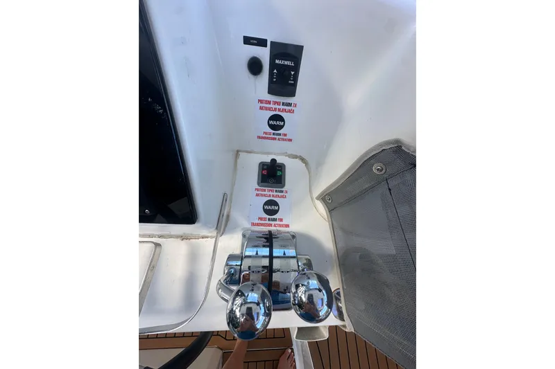 Bolubo Yacht Photos Pics Control panel of a 2019 Lagoon 42 catamaran with throttle levers and warning labels.