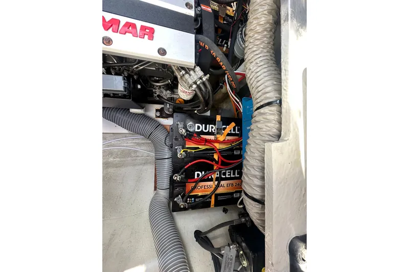 Bolubo Yacht Photos Pics Engine compartment of a 2019 Lagoon 42 with Duracell batteries and wiring.