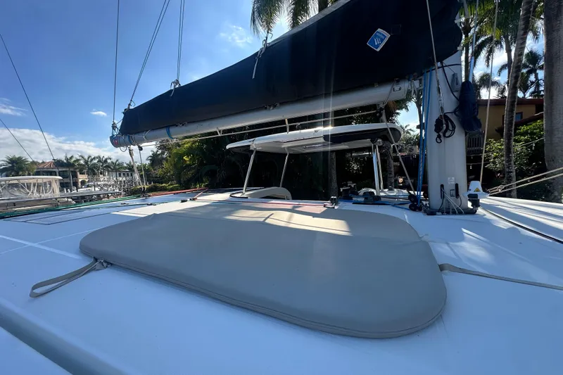 Bolubo Yacht Photos Pics 2019 Lagoon 42 catamaran deck with sail and tropical backdrop.