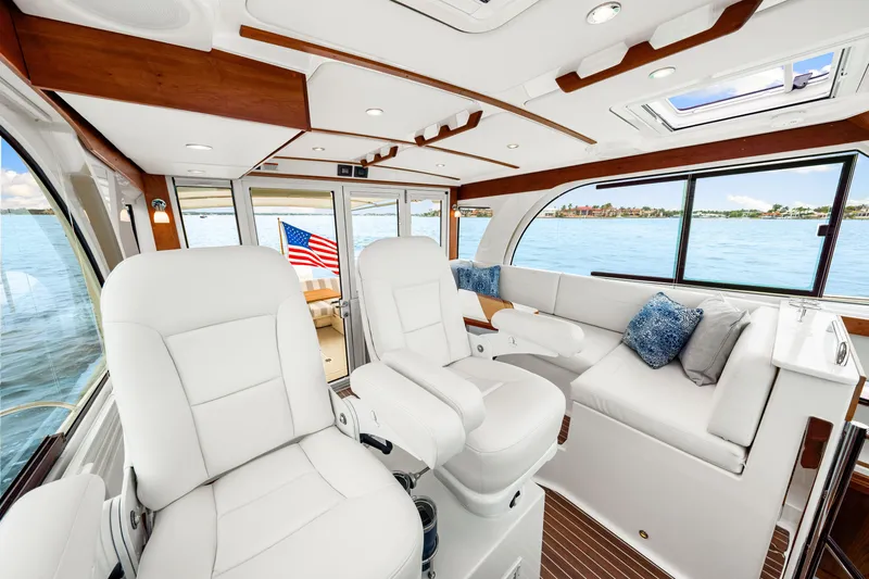  Yacht Photos Pics Luxurious interior of 2024 Back Cove 39O yacht with plush seating and scenic water view.