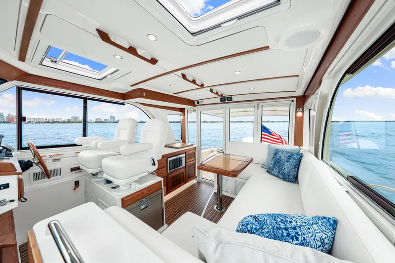  Yacht Photos Pics Luxurious interior of 2024 Back Cove 39O yacht with elegant seating and panoramic windows.