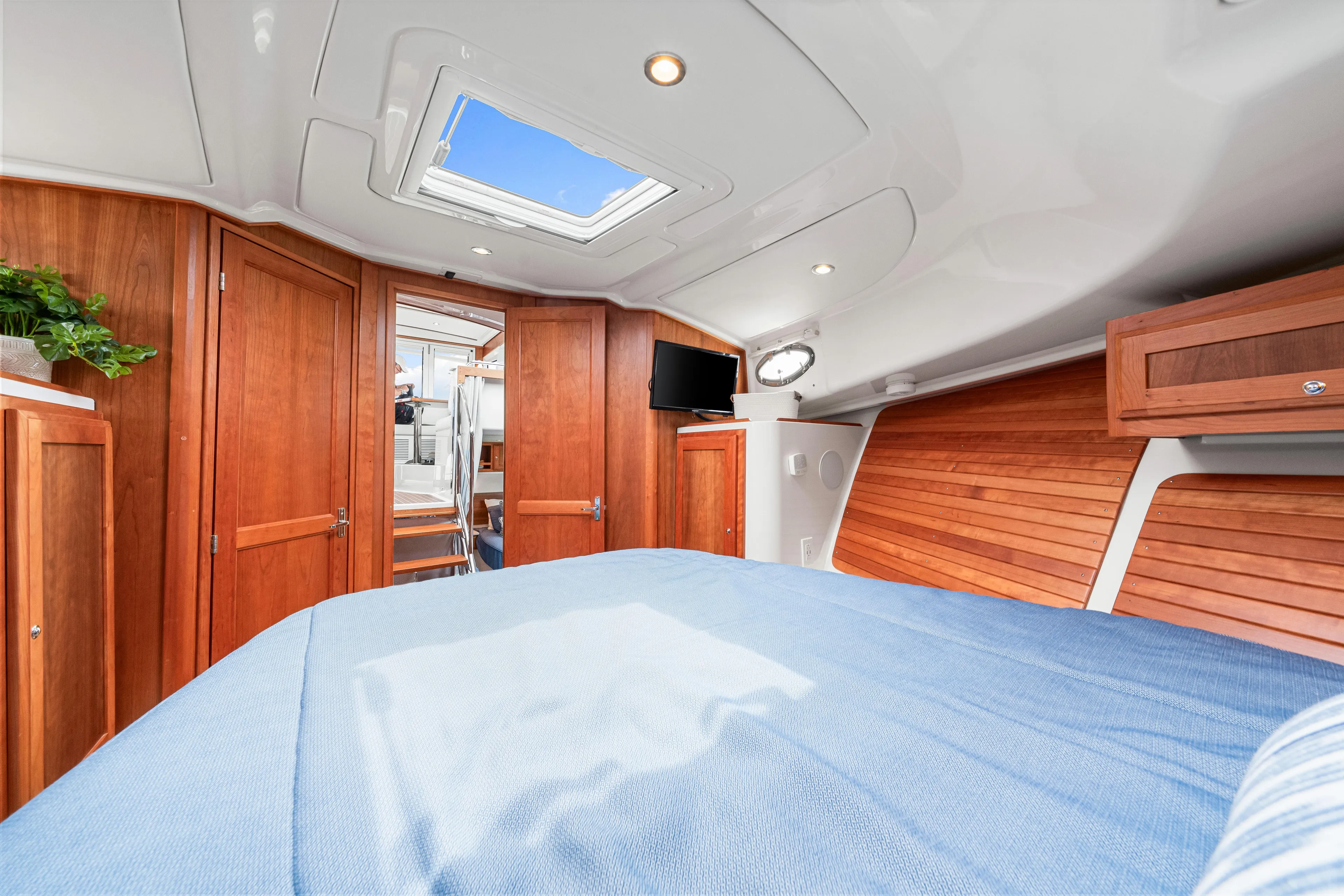  Yacht Photos Pics Luxurious cabin interior of 2024 Back Cove 39O yacht with wood accents and skylight.