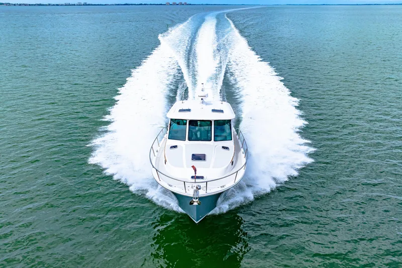  Yacht Photos Pics 2024 Back Cove 39O cruising on open water, leaving a wake behind.