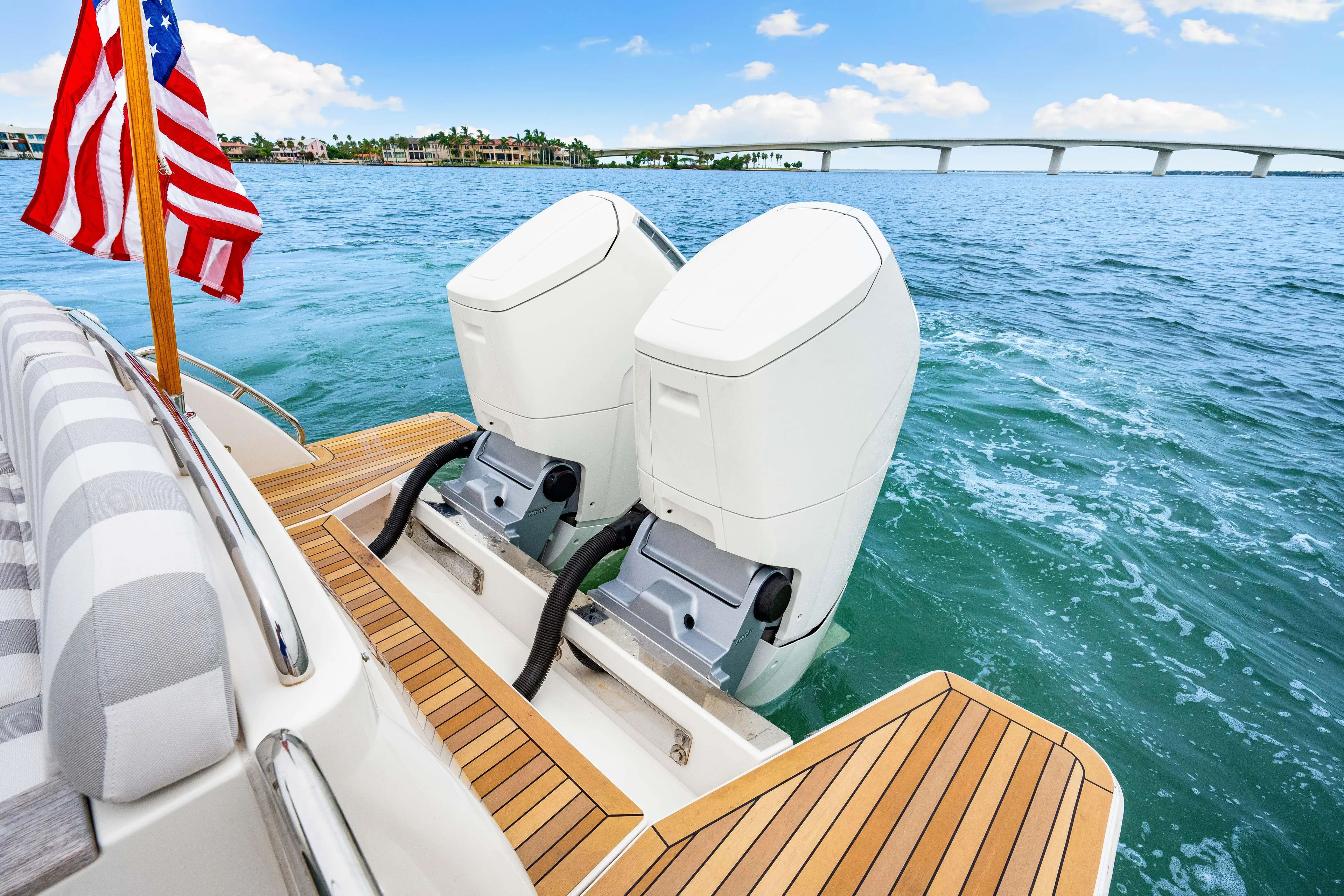  Yacht Photos Pics 2024 Back Cove 39O boat with dual engines, American flag, and scenic ocean view.