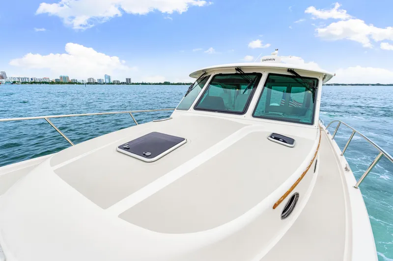  Yacht Photos Pics 2024 Back Cove 39O boat on water, showcasing sleek design and modern features.