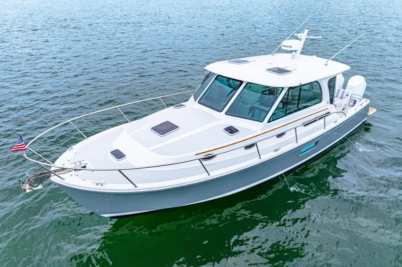  Yacht Photos Pics 2024 Back Cove 39O boat cruising on open water, showcasing sleek design and modern features.