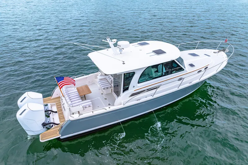  Yacht Photos Pics 2024 Back Cove 39O boat on water, featuring sleek design and dual outboard engines.