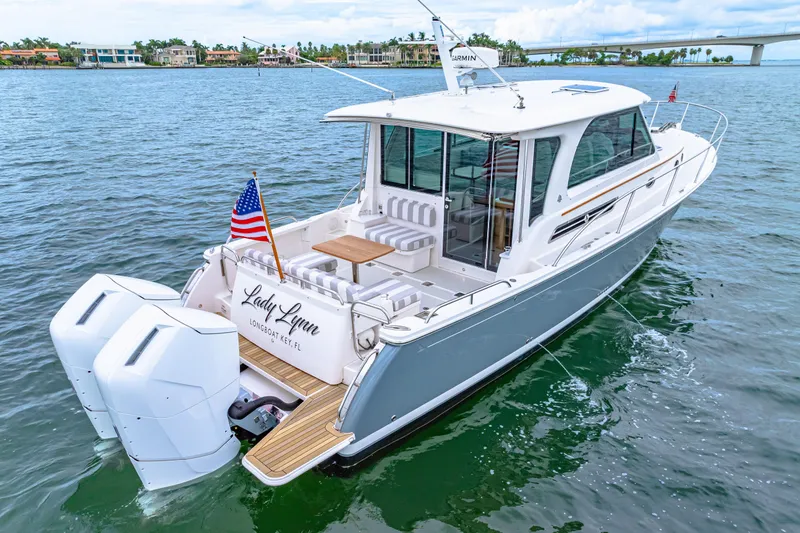 Yacht Photos Pics 2024 Back Cove 39O yacht on water, featuring sleek design and dual outboard engines.