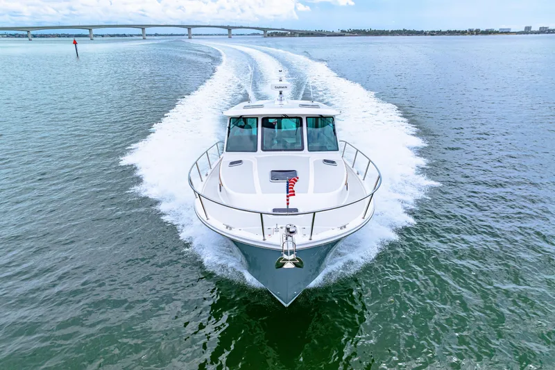  Yacht Photos Pics 2024 Back Cove 39O cruising on open water, showcasing sleek design and powerful performance.