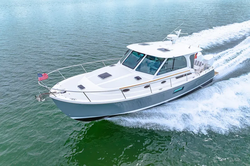  Yacht Photos Pics 2024 Back Cove 39O yacht cruising on open water, displaying sleek design and performance.