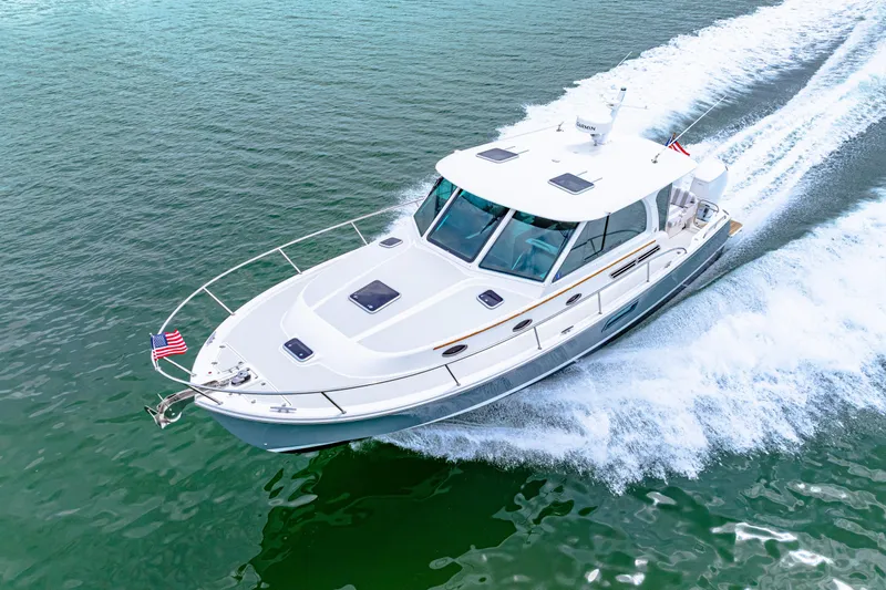  Yacht Photos Pics 2024 Back Cove 39O yacht cruising on open water, displaying sleek design and performance.