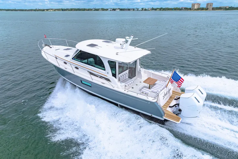  Yacht Photos Pics 2024 Back Cove 39O yacht cruising on open water, showcasing sleek design and powerful engines.