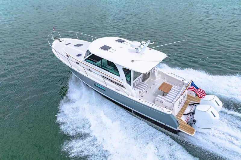  Yacht Photos Pics 2024 Back Cove 39O yacht cruising on open water, showcasing sleek design and powerful engines.