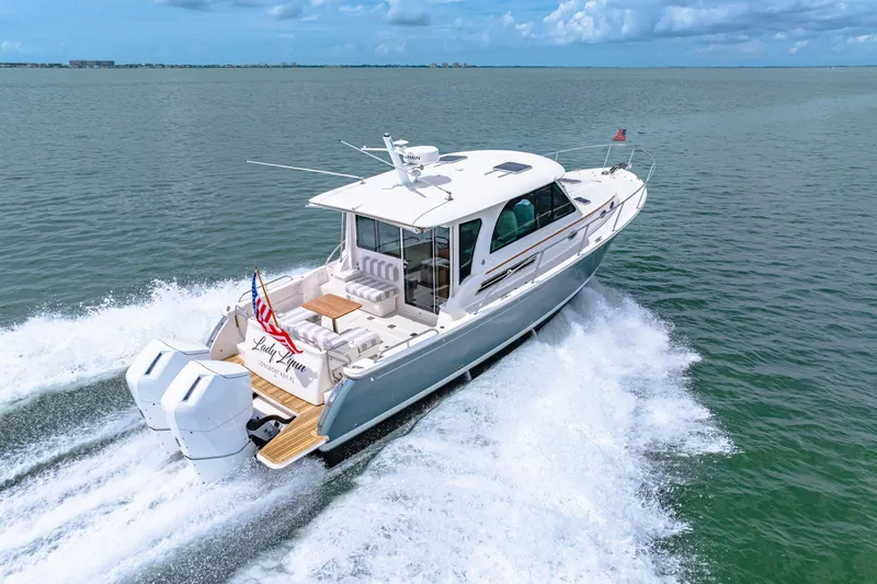  Yacht Photos Pics 2024 Back Cove 39O yacht cruising on open water, showcasing sleek design and powerful engines.