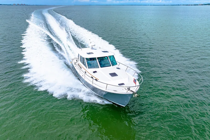  Yacht Photos Pics 2024 Back Cove 39O cruising on open water, showcasing sleek design and performance.