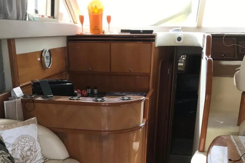 1744 Yacht Photos Pics Luxurious interior of 2003 Princess 45 Flybridge Motor Yacht with elegant wood finish.