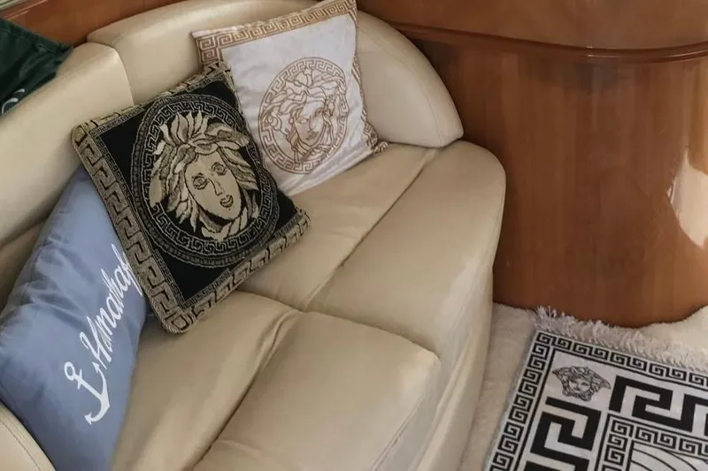 1744 Yacht Photos Pics Luxurious interior of 2003 Princess 45 Flybridge Yacht with elegant cushions and decor.