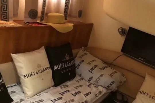 1744 Yacht Photos Pics Interior of 2003 Princess 45 Flybridge Yacht with Mo&euml;t & Chandon pillows and TV.