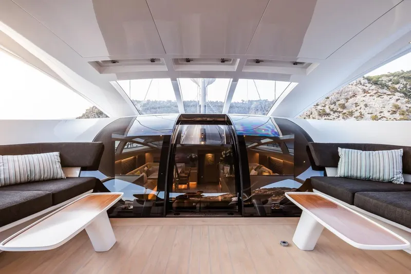 Liara Yacht Photos Pics Luxurious interior of 2019 Baltic Custom 112 yacht with modern seating and panoramic windows.