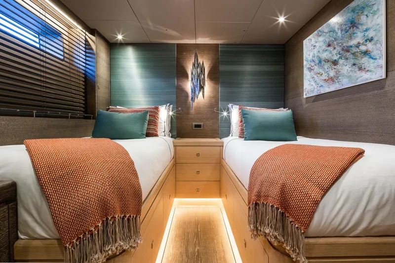 Liara Yacht Photos Pics Luxurious twin cabin interior on 2019 Baltic Custom 112 yacht, featuring modern decor and ambient lighting.