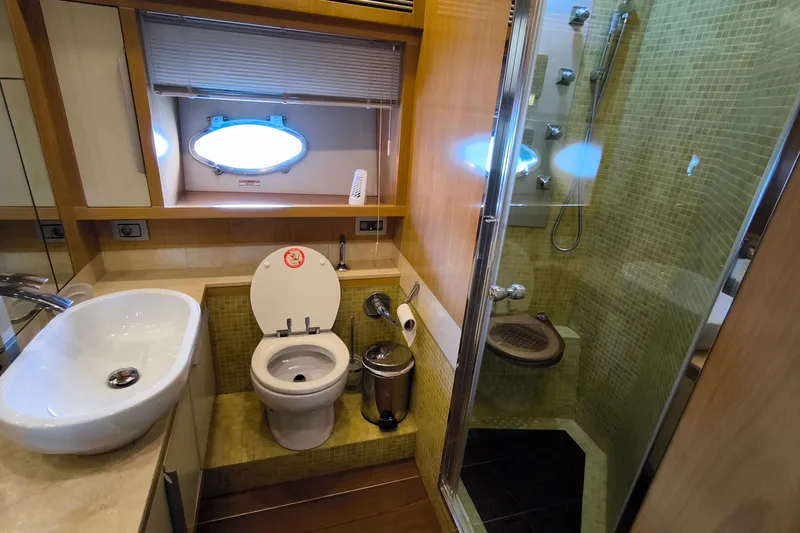 Mister Corn Yacht Photos Pics Luxurious bathroom in 2010 Rodman Muse 74 yacht with modern fixtures and shower.