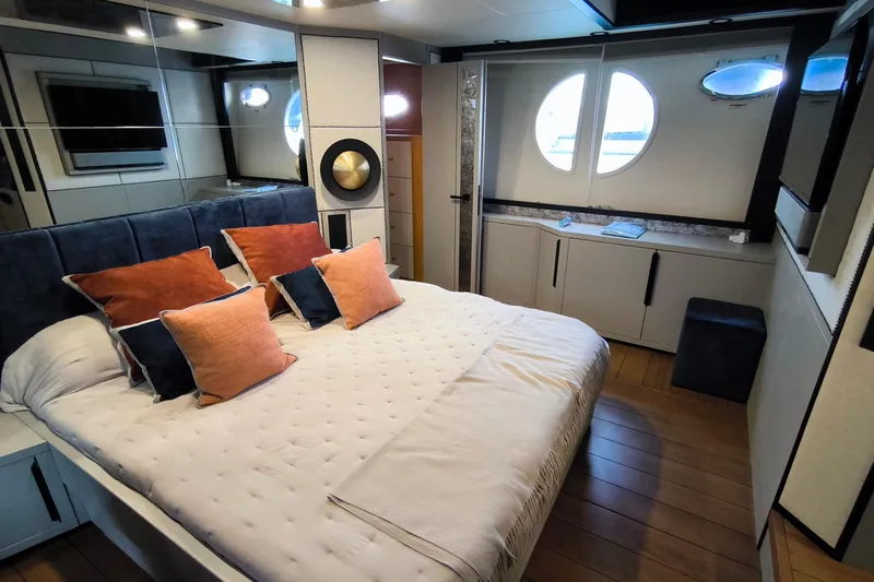 Mister Corn Yacht Photos Pics Luxurious bedroom interior on 2010 Rodman Muse 74 yacht with plush bedding and modern decor.