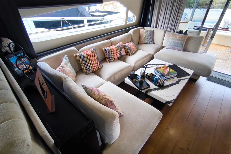 Mister Corn Yacht Photos Pics Luxurious interior of 2010 Rodman Muse 74 yacht with plush seating and modern decor.