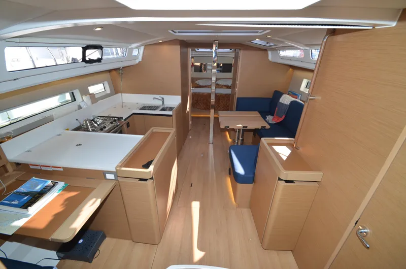 Her Intentions Yacht Photos Pics Interior of 2021 Jeanneau Sun Odyssey 440 yacht, featuring modern kitchen and seating area.