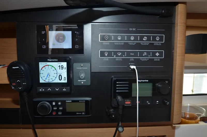 Her Intentions Yacht Photos Pics Control panel of 2021 Jeanneau Sun Odyssey 440 yacht with navigation and communication equipment.