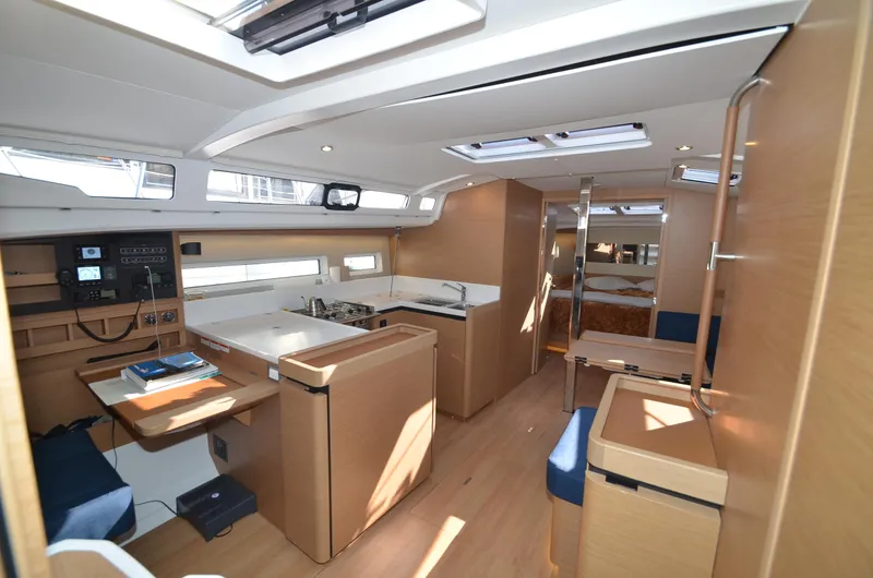 Her Intentions Yacht Photos Pics Interior of 2021 Jeanneau Sun Odyssey 440 yacht, featuring modern kitchen and navigation area.