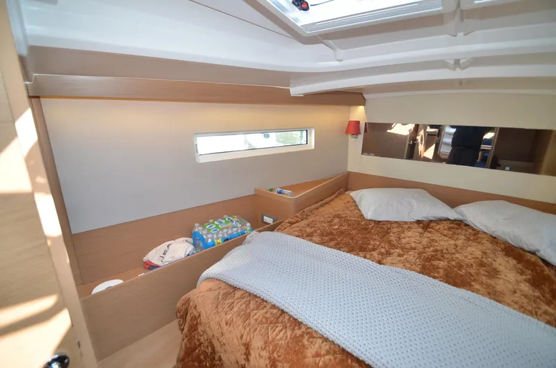 Her Intentions Yacht Photos Pics Cozy cabin interior of 2021 Jeanneau Sun Odyssey 440 sailboat with plush bedding.