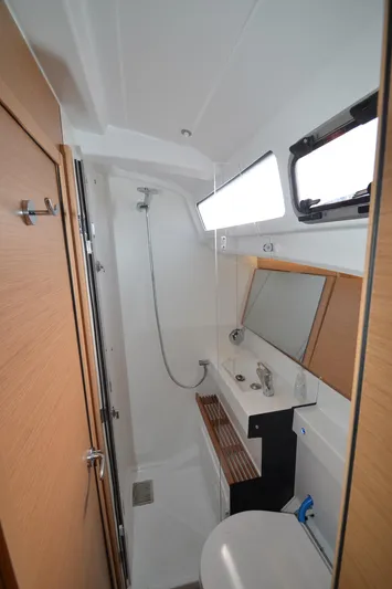 Her Intentions Yacht Photos Pics Modern bathroom in 2021 Jeanneau Sun Odyssey 440 yacht with shower and sink.