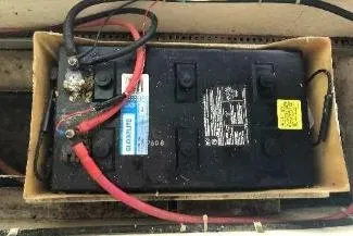 Moments Notice Yacht Photos Pics Battery setup in a 1981 Sea Ranger 47 boat with connected cables.